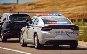 A driver getting pulled over by police. Learn about what aggravated DUI means.