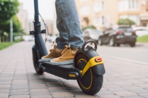 A person riding an electric scooter. Learn about whether you can get a DUI on a scooter.